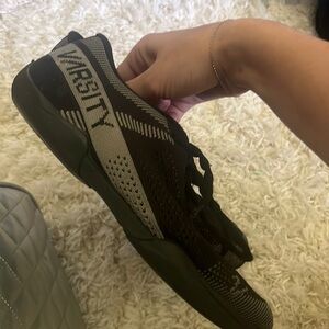 Black Varsity cheerleading shoes with shoe bag